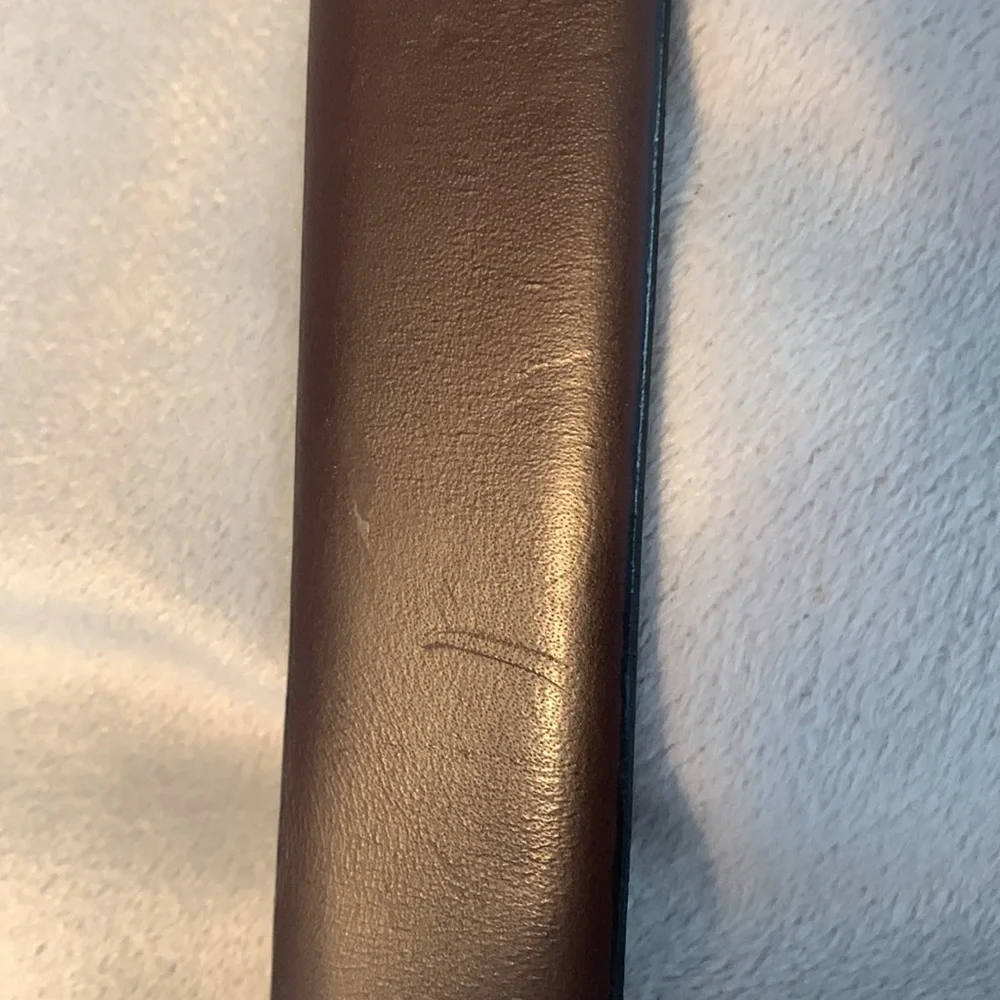 The mens warehouse smooth brown leather belt made in Italy size 38 thin dressy